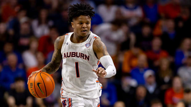 Feb 19, 2022; Gainesville, Florida, USA; Auburn Tigers guard Wendell Green Jr. (1) dribbles the ball during the first half against the Florida Gators at Billy Donovan Court at Exactech Arena. Mandatory Credit: Matt Pendleton-USA TODAY Sports